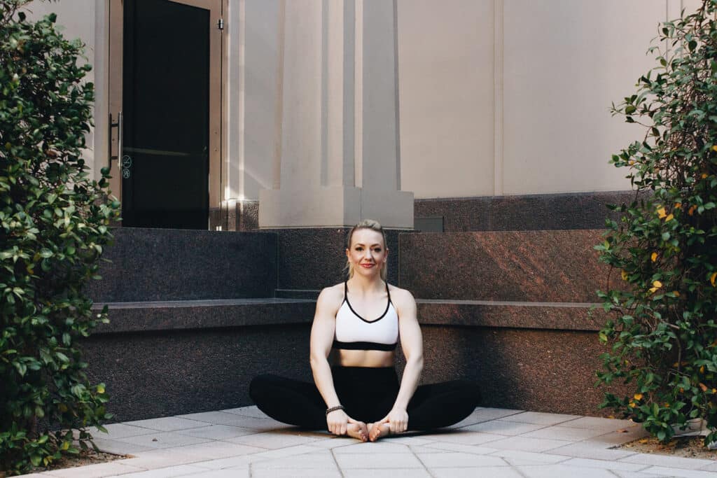 jillian travel and wellness influencer demonstrating a yoga pose