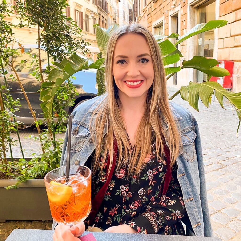 jillian spritz sunday travel and wellness influencer and blogger enjoying an aperol spritz in Rome, Italy