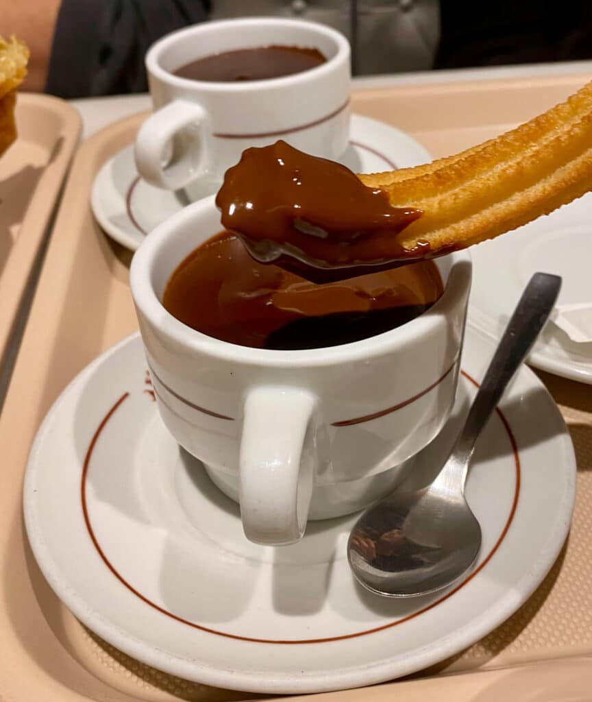 churro and hot chocolate at breakfast in spain