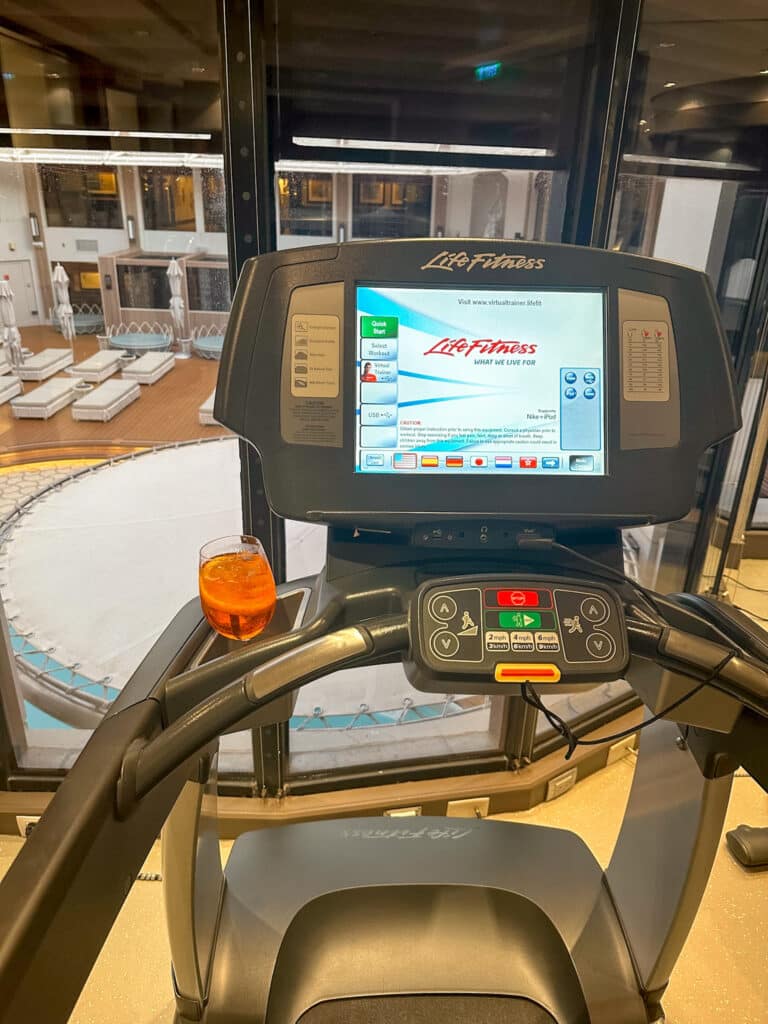 treadmill on a cruise ship with an aperol spritz