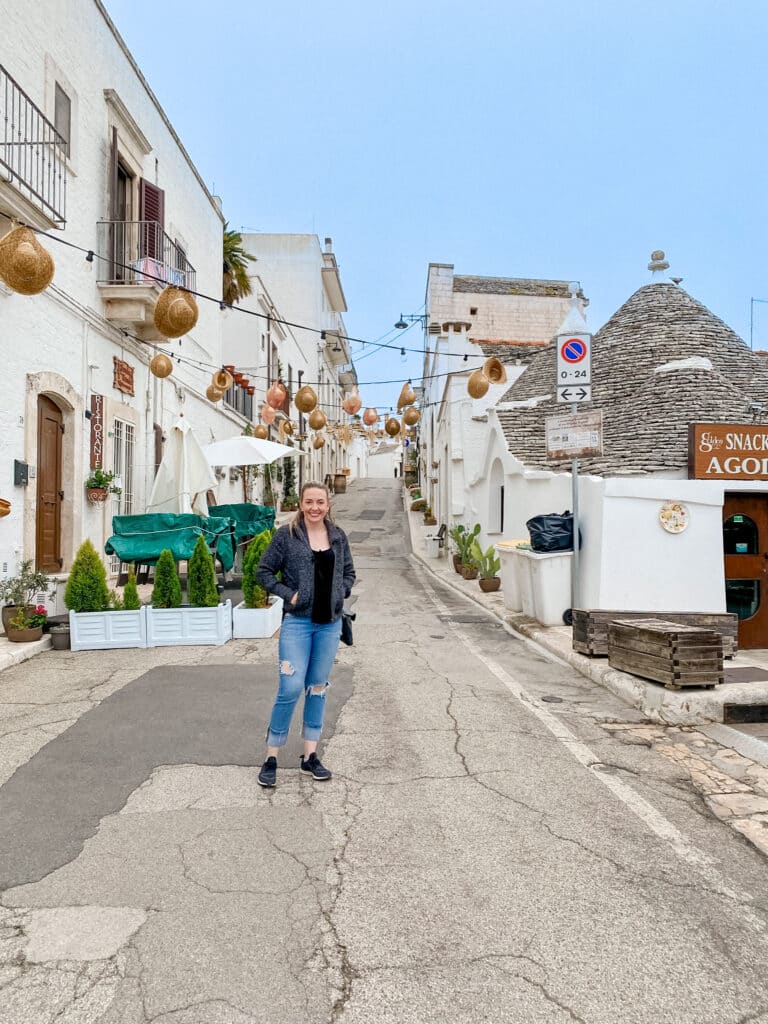 jillian, travel and wellness influencer, in Alberobello in Puglia, Italy