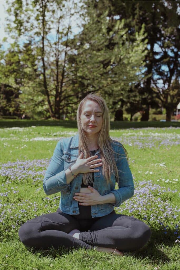 jillian, travel and wellness influencer, practicing her mind-body connection at the park