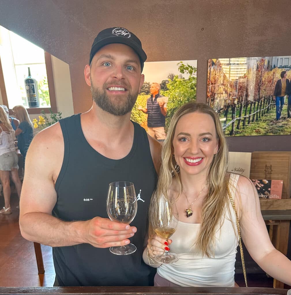 Jillian, travel and wellness influencer, and her partner Brandon at Vintner’s Collective in downtown Napa Valley